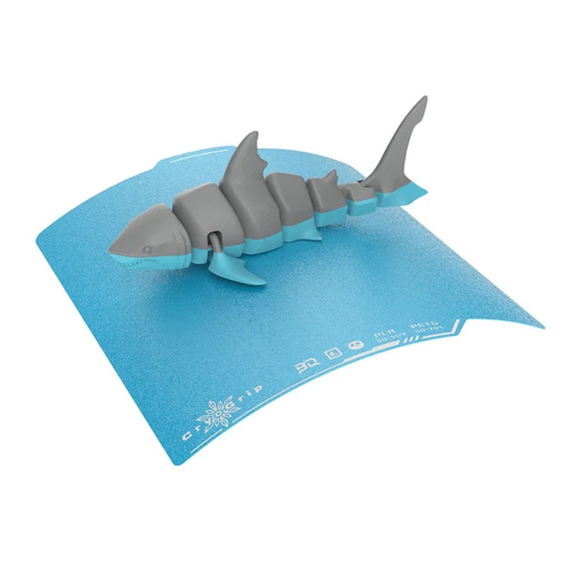 BIQU Panda CryoGrip Pro Frostbite plate being flexed to release a 3D printed shark model easily.