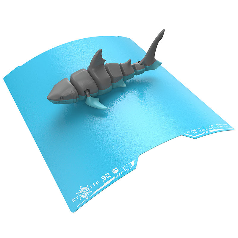 Flexible BIQU CryoGrip Pro Frostbite build plate flexing to remove a 3D printed shark model