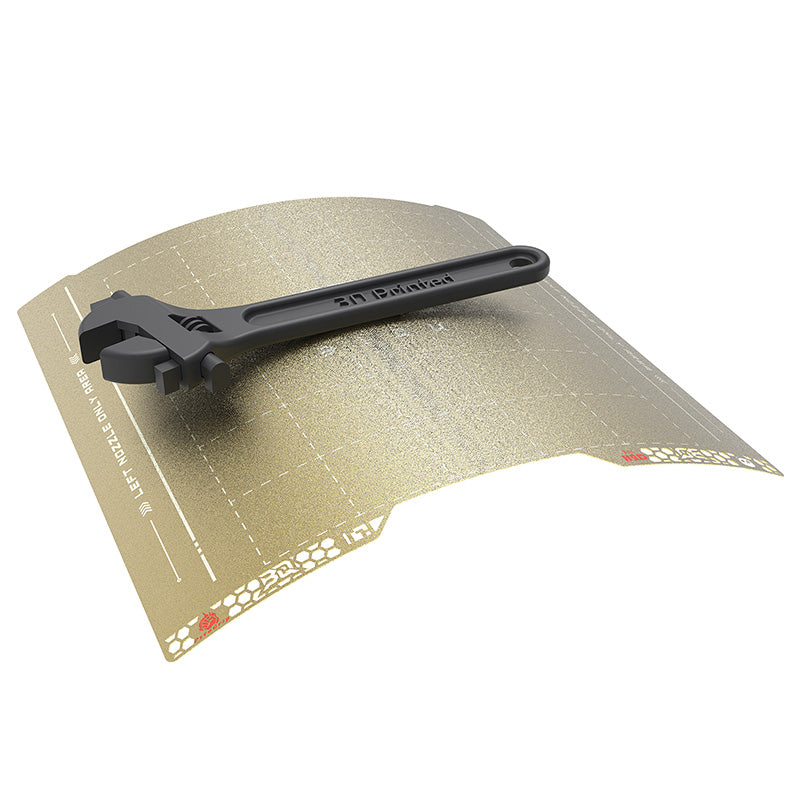 BIQU Pyrogrip flexible spring steel sheet bending with an adjustable wrench on top to demonstrate thermal resistance and flex-to-remove print feature.