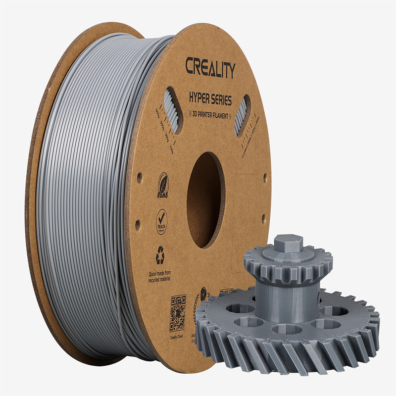 Spool of Creality Hyper Series 3D printer ABS filament with a printed grey object on a white backgrounder