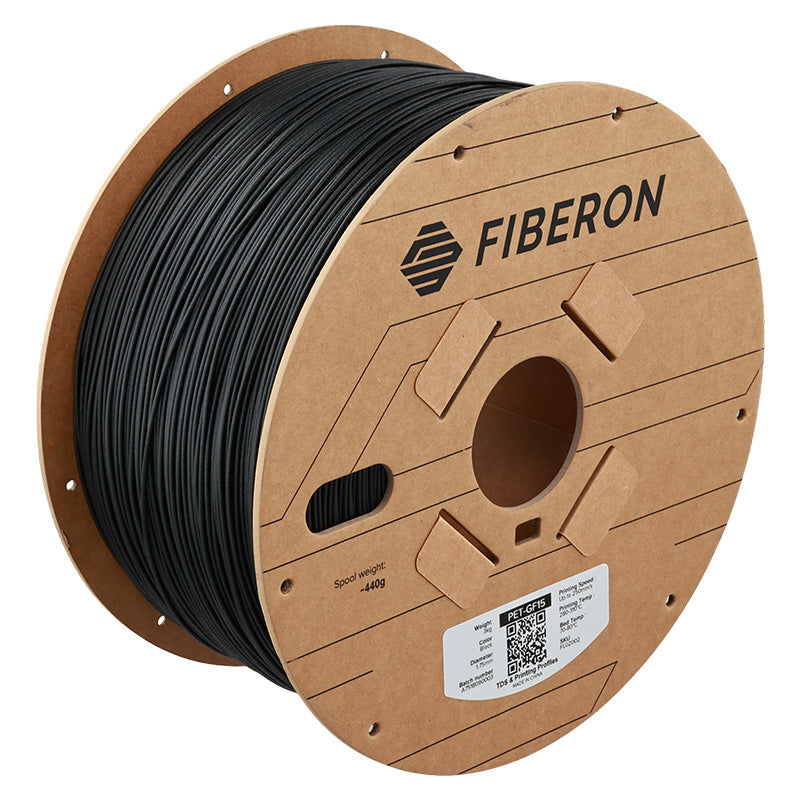 Spool of black filament on a cardboard reel with Fiberon branding.