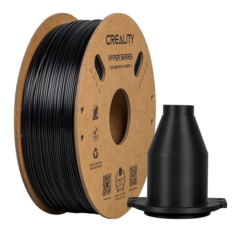 Spool of Creality Hyper Series 3D printer ABS filament with a printed black object on a white backgrounder 