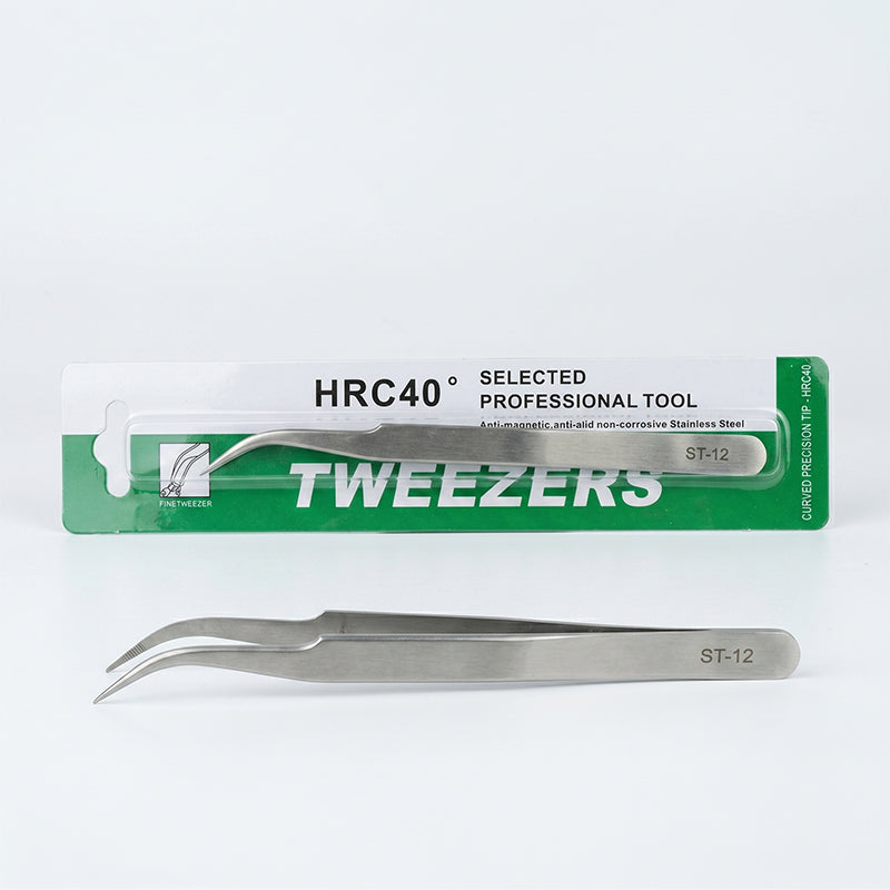 Pair of tweezers with a green and white packaging label on a light gray background