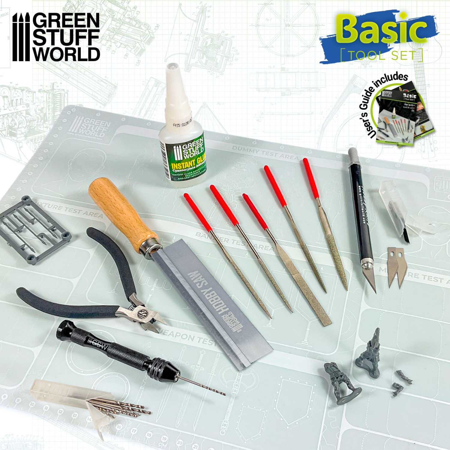 Green Stuff World Basic Tool Set with tools and glue on a white surface